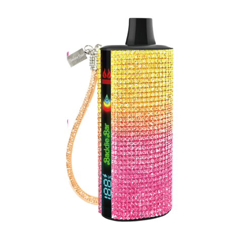 A baddie bar vape pen covered in pink-to-yellow rhinestones with a black top and gold wrist strap