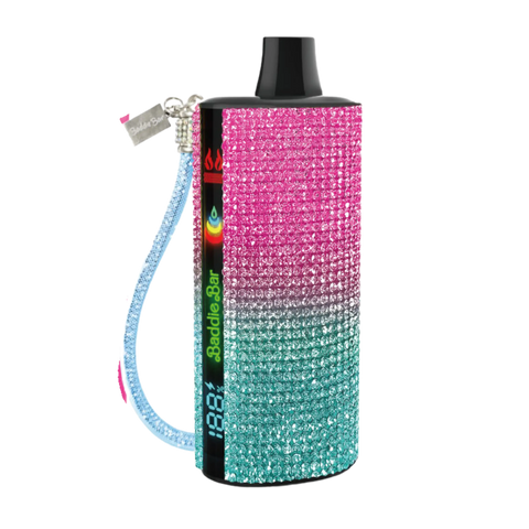 A sparkling gradient baddie bar vape device decorated with pink white and teal rhinestones with black top cap and blue wrist strap