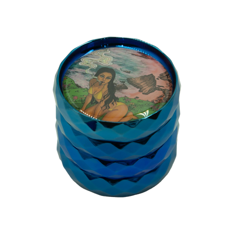 Blue metallic herb grinder with colorful illustration of a woman in a bikini smoking on the lid