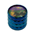 Vibrant blue metallic grinder with a colorful illustrated lid showing two people in a scenic landscape