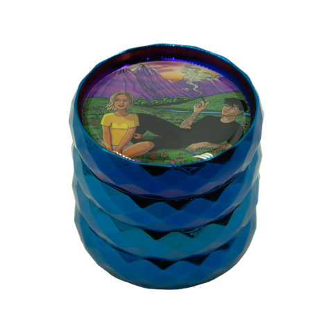Vibrant blue metallic grinder with a colorful illustrated lid showing two people in a scenic landscape