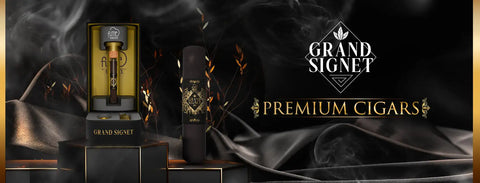A dark brown, hand-rolled grand signet premium cigar with gold and black ornate banding.
