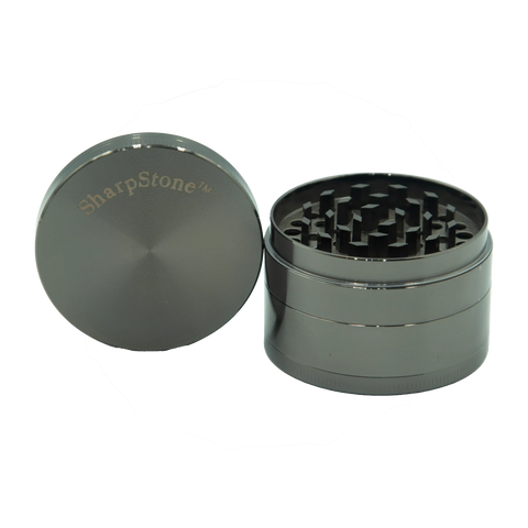 Silver metallic four-piece metal herb grinder with brushed finish and sharpstone logo engraved on lid
