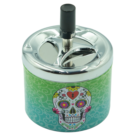 SpinTop metal ashtray pop series with vibrant green and teal sugar skull design and chrome lid with black cigarette holder