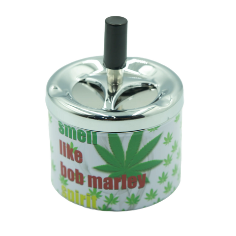 Chrome-finished metal ashtray spinTop pop series with white body green cannabis leaves and smell like Bob Marley spirit text