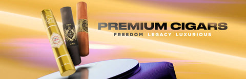 Three premium cigars in gold, black and brown cylindrical wrappers with ornate branding.