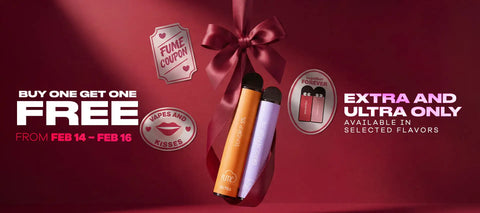 Two sleek, cylindrical vape pens with matte orange and lavender finishes stand upright against a deep red background.