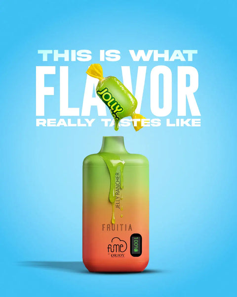 A vibrant gradient green-to-orange vape pen with a glossy finish, featuring the ’fruitia’ branding and “jelly rancher” flavor label.